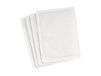 Four white self-adhesive heat patches fanned out on a white background