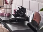 Cien Beauty hair dryer with diffuser and hair brushes on a bathroom shelf.