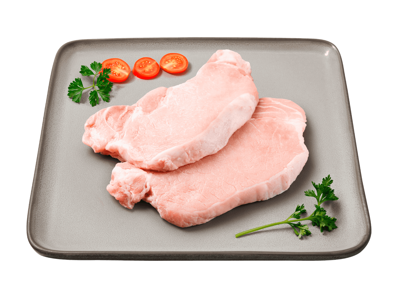 Deux tranches de porc crues avec des tomates cerises et du persil sur une assiette grise.