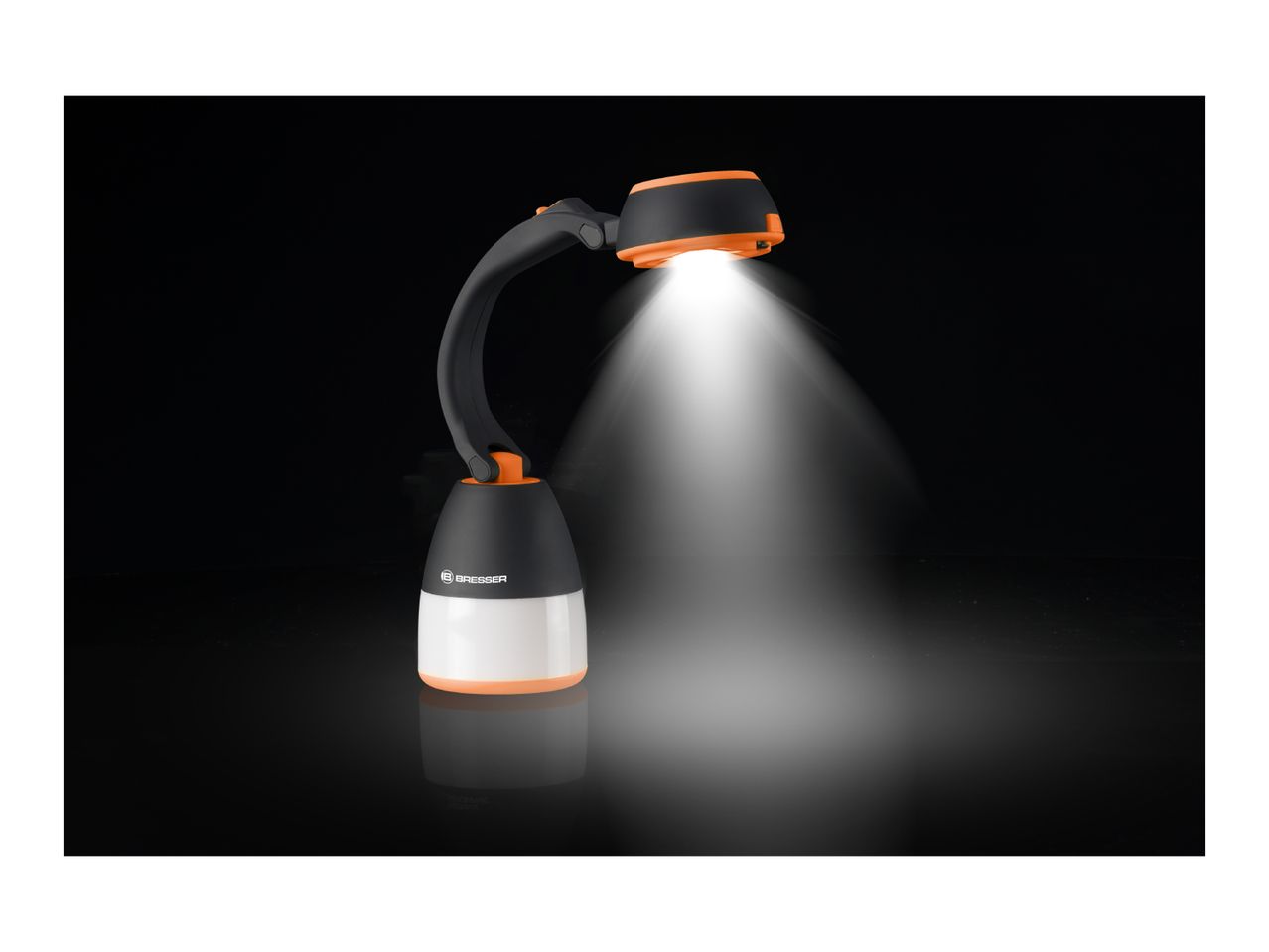 Black and orange camping lantern with a flexible neck, emitting a bright white light.