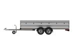 A side profile of a gray cargo trailer with dual wheels and a jockey wheel.