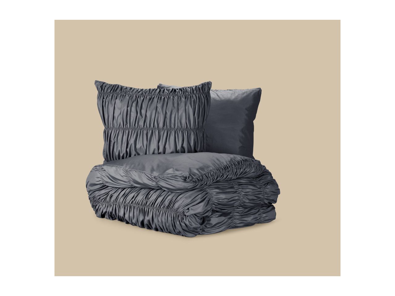 Grey ruched bedding set with a folded duvet and two pillows