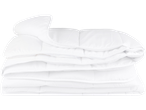 Folded white duvets.