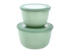 Two light green food storage containers with lids, stacked on a white background.