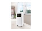Portable air conditioner with exhaust hose in a room with a window and bookshelf