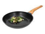 Frying pan with wooden handle and cooked vegetables