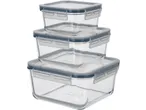 A stack of three clear glass food storage containers with grey airtight lids.