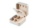 A beige, square-shaped jewelry box with compartments for earrings and other small accessories.