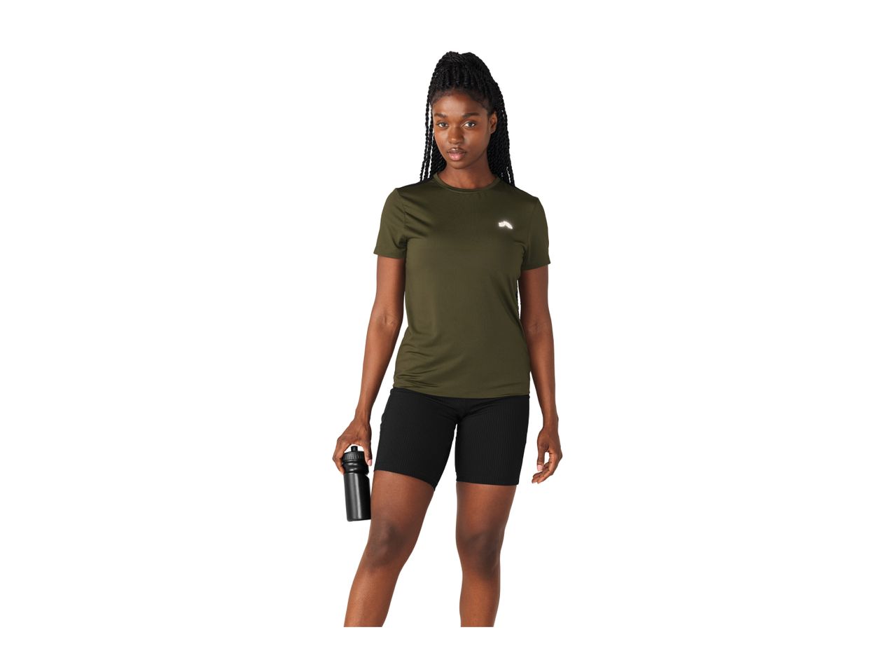 Woman in a green sports t-shirt and black cycling shorts holding a water bottle.