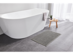 LIVARNO home Bath Mat on a gray tiled bathroom floor with a white tub.