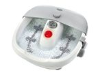 Foot spa with bubbling water, massage rollers, and a control dial.