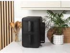 Salter VertiCook Air Fryer 10L on a kitchen counter with wooden utensils and a plant.