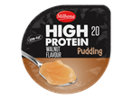 Milbona Pudding saveur noix riche en protéines, faible en gras, avec une cuillère de pudding.
