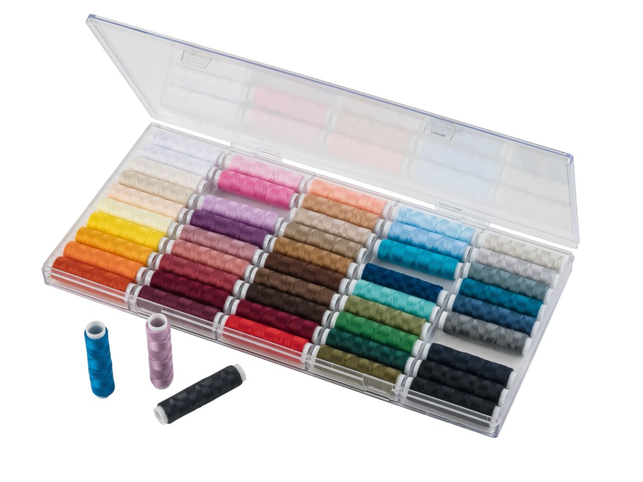 A clear plastic case filled with spools of colorful sewing thread, with three spools outside.