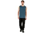 A man models a Tank Top and black work pants.