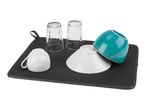 A dark gray drying mat with two glasses, a teal bowl, and two white dishes.