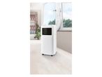 White portable air conditioner by a window.