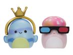 Two squishy toys: a blue one with a gold crown and a pink mushroom with 3D glasses.
