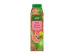 Pink guava nectar in a bottle with a green cap, featuring sliced and whole guavas on a woven background.