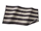 Striped bath mat in dark grey and light grey, with a slight curl on one corner.