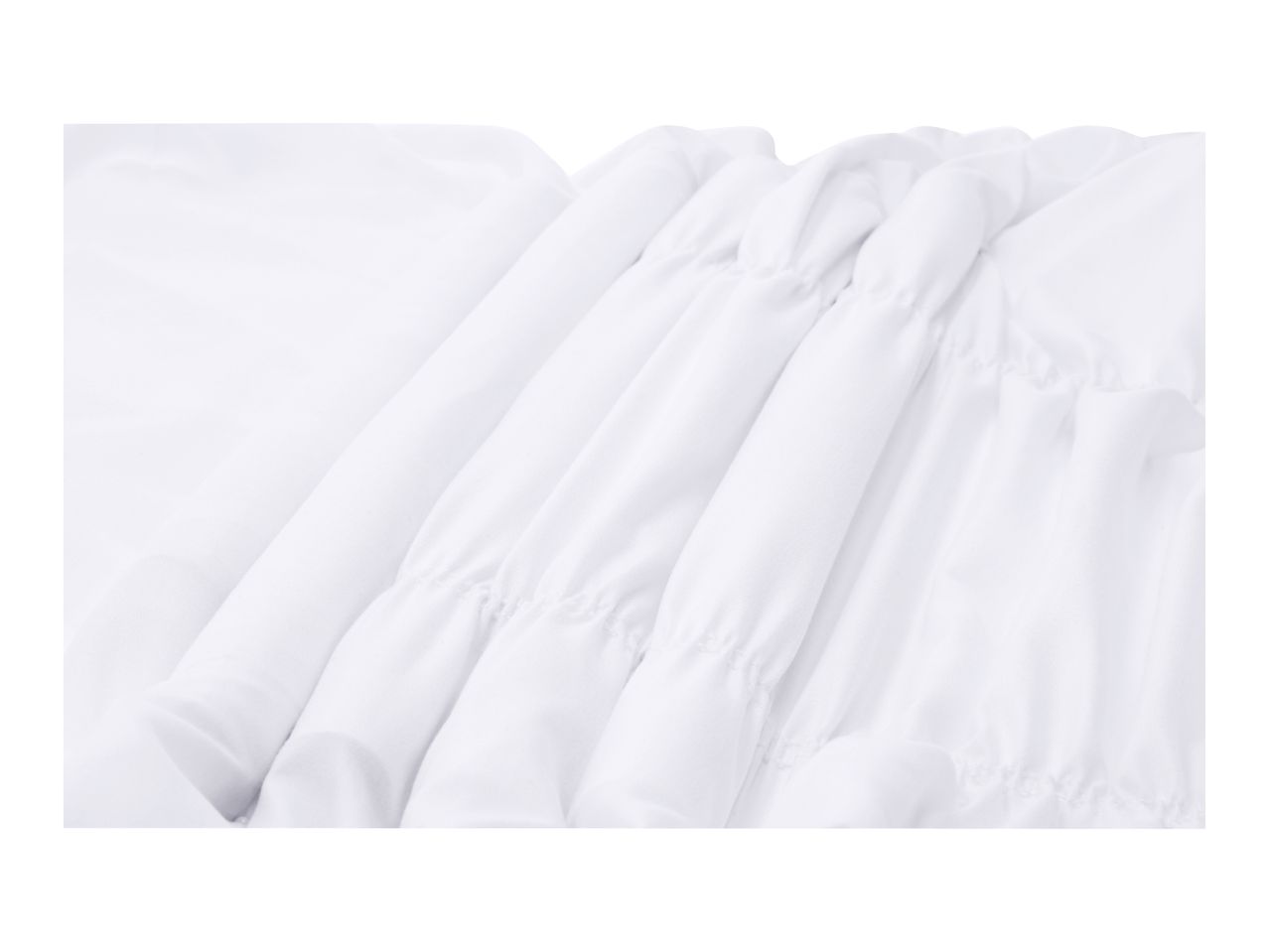 Close-up of white fabric with elasticated gathering details