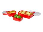 Red food containers with lasagna, pasta with tomatoes, and broccoli.
