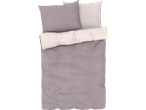 A mauve and white patterned duvet cover set with matching pillows.