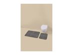 Two striped bath mats in front of a wall-mounted toilet in a beige bathroom.
