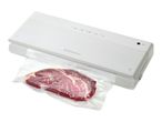 White vacuum sealer packaging a piece of raw meat in a plastic bag