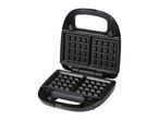 Open black waffle maker with square grids, ready for use.
