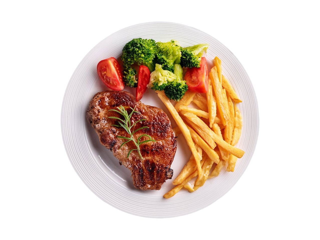 Grilled pork chop with french fries, broccoli, and tomatoes on a white plate.