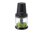 Black and clear food chopper with parsley inside, showing measurement markings.