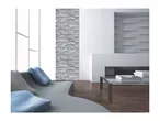 Modern living room with a gray sofa, stone accent wall, and a glass coffee table.