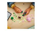 Overhead shot of a child's hands assembling colorful building blocks into plants and animals.