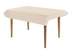 Rectangular table with a light beige tablecloth and wooden legs.