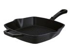 Black cast iron square grill pan with a handle and ribbed cooking surface.