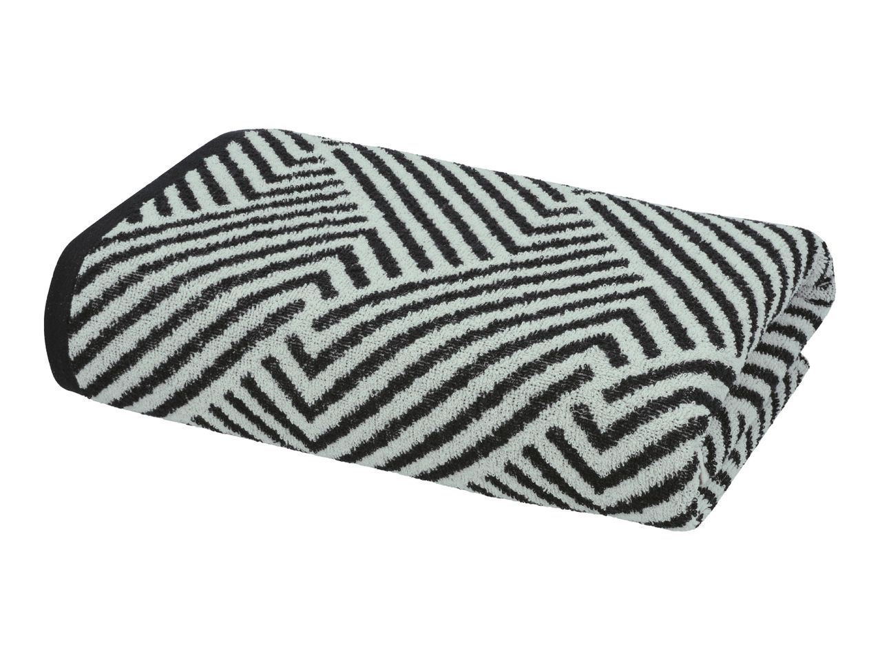 Folded towel with a black and white geometric pattern