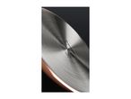 Close-up of the stainless steel base of a copper-colored pan with hob compatibility symbols.