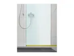 A shower stall with a glass door and a measuring tape on the floor showing the width.