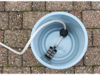 A blue bucket with a water filter and hose.