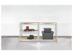 Storage shelves with plastic containers, tools, and boots.