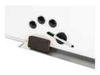 Whiteboard with magnets, eraser, and marker, resting on a silver tray.
