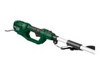 Green and black electric garden tool with a long white pole and a black strap.