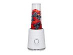 White personal blender filled with fresh strawberries and blueberries