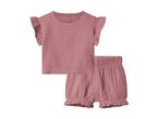 Pink muslin baby top with ruffled sleeves and matching shorts with elastic waist.