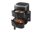 Dual-basket air fryer with chicken breasts and chicken wings cooking, digital display showing 150°C and 180°C.