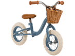 Puky balance bike, light blue, with wicker basket.