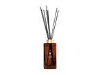 Oud & Velvet reed diffuser in a brown glass bottle with a gold cap