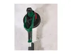 A green and black drywall sander with a circular head against a textured wall.