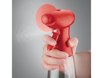 Red spray bottle and clear bottle.